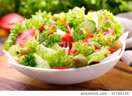 bowl of fresh salad with vegetables and greens bowl of fresh salad with vegetables and greens 35780138