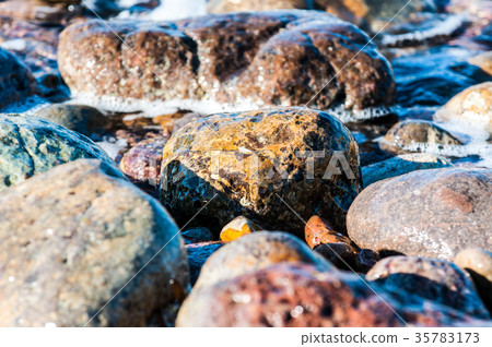 pebbles in the shore 35783173