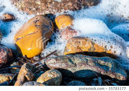 pebbles in the shore 35783177