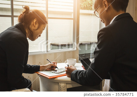 Hard work of young business lawyer at courtroom Hard work of young business lawyer at courtroom 35784771