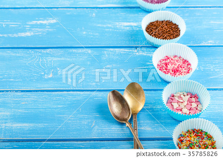 candy sprinkles on the paper cupcake holder candy sprinkles on the paper cupcake holder 35785826