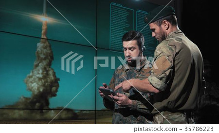 Military men calculating location for missile 35786223