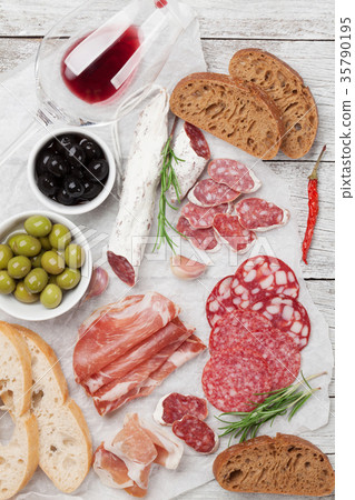 Salami, ham, sausage, prosciutto and wine Salami, ham, sausage, prosciutto and wine 35790195