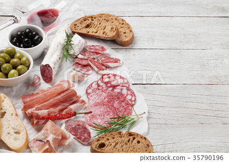 Salami, ham, sausage, prosciutto and wine Salami, ham, sausage, prosciutto and wine 35790196