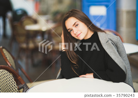 Portrait of a young beautiful woman in a urban Portrait of a young beautiful woman in a urban 35790243