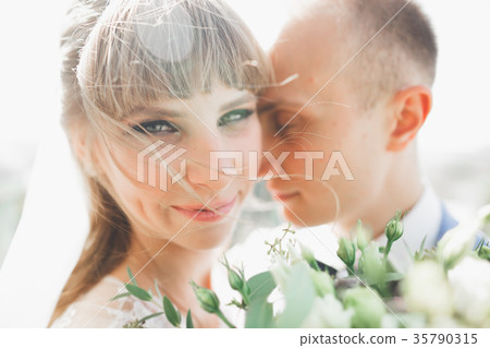 Sensual portrait of a young wedding couple Sensual portrait of a young wedding couple 35790315