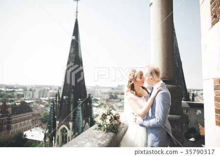 Stylish beautiful wedding couple kissing and Stylish beautiful wedding couple kissing and 35790317