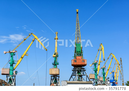 Harbor cranes on blue sky background 35791778