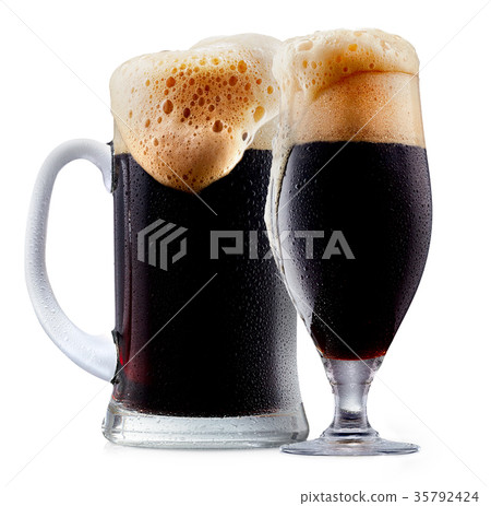Mug of frosty dark beer with foam Mug of frosty dark beer with foam 35792424