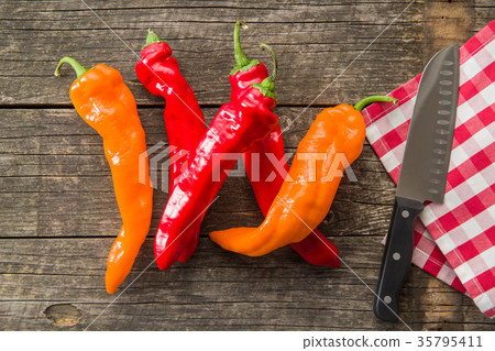 Orange and red peppers. 35795411