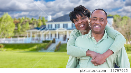 Happy African American Couple In Front of Beautiful House. 35797925