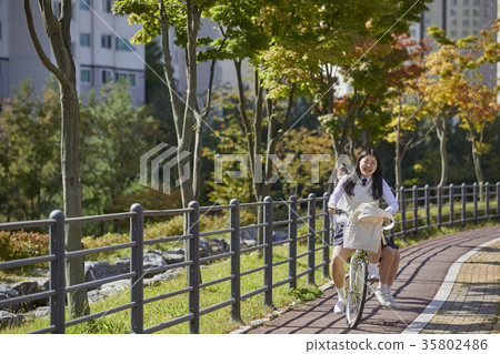 Friends, high school students, parks, bicycles Friends, high school students, parks, bicycles 35802486