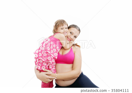 Beautiful pregnant woman with her daughter. 35804111