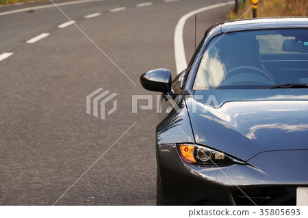 Drive image: The front of a sports car with a parked shoulder Drive image: The front of a sports car with a parked shoulder 35805693