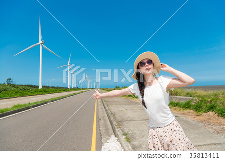 woman trying to make a free ride thumbs up 35813411