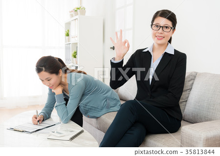 professional business woman showing okay gesture 35813844