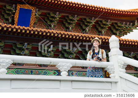 tourist looking at view of chinese temple. tourist looking at view of chinese temple. 35815606