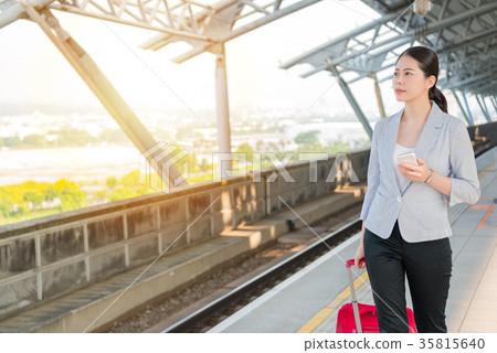 business woman walking on the rail platform 35815640