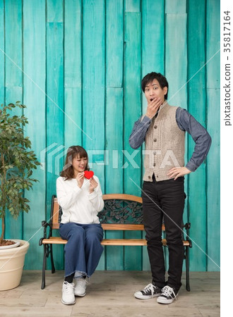 Surprised man giving a present 35817164