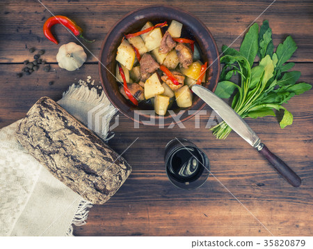 Still life of vegetables, baked potatoes with meat 35820879