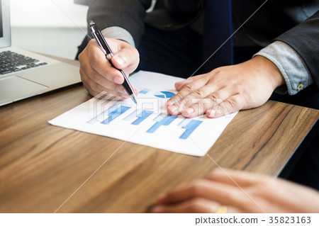 Business man analysed report of profit finance data graph docume Business man analysed report of profit finance data graph docume 35823163