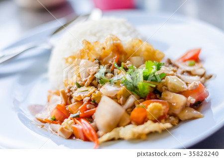 Rice topped sweet and sour pork and fried egg Rice topped sweet and sour pork and fried egg 35828240