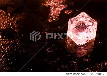 Red ice cubes and water drop background. Red ice cubes and water drop background. 35829817