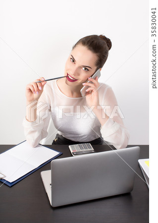 the business woman thoughtfully looks in the the business woman thoughtfully looks in the 35830041