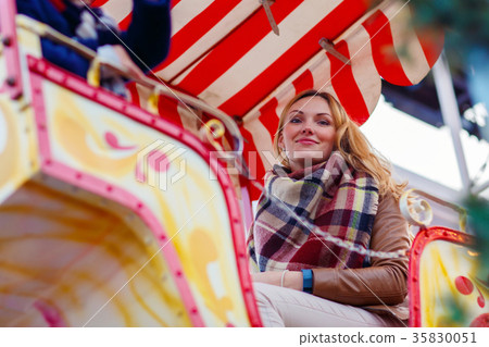 Young woman on ferris wheel on christmas market Young woman on ferris wheel on christmas market 35830051