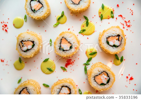 Sushi rolls scattered on white background Sushi rolls scattered on white background 35833196