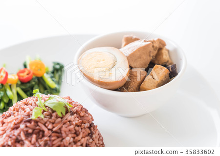 Eggs and chicken in brown sauce with berry rice Eggs and chicken in brown sauce with berry rice 35833602