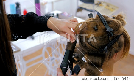 Professional hairdresser doing hairstyle for Professional hairdresser doing hairstyle for 35835444