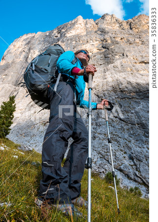 Tourist hiking in mountains 35836333