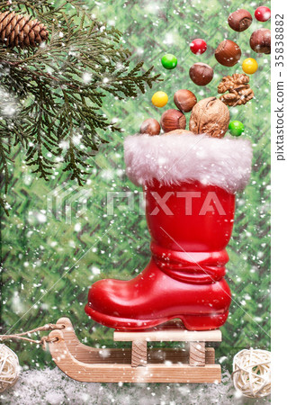 Red christmas boot with nuts on a sled Red christmas boot with nuts on a sled 35838882