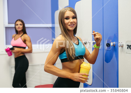 Young slim girls shot in a fitness gym cloakroom Young slim girls shot in a fitness gym cloakroom 35840804