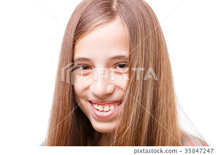 Young happy teenage girl with long beautiful hair Young happy teenage girl with long beautiful hair 35847247