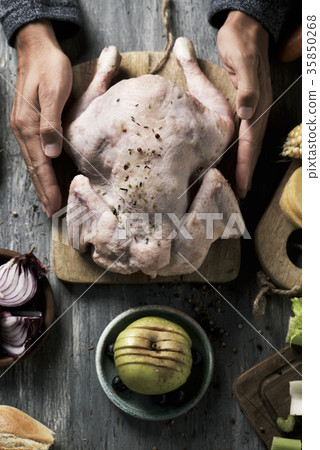 young man about to prepare a turkey 35850268