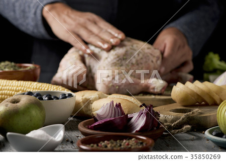 young man preparing a turkey young man preparing a turkey 35850269