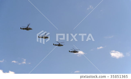 Combat helicopters Ka-52 fly in blue sky 35851365
