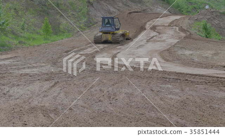 Bulldozer on tracks at mountain road construction Bulldozer on tracks at mountain road construction 35851444
