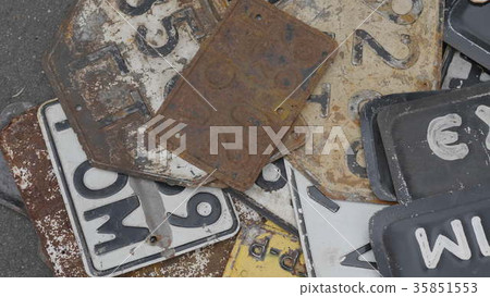 Old rusty license plates of cars. 35851553