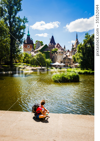 girl tourist sits overlooking the castle medieval girl tourist sits overlooking the castle medieval 35852044