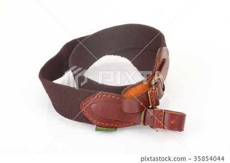 armored brown leather belt on white background armored brown leather belt on white background 35854044