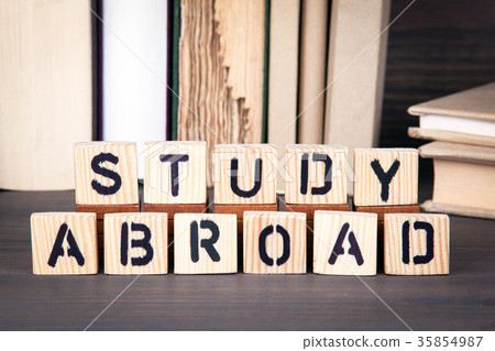 study abroad, wooden letters on wooden table. Education, success and communication background study abroad, wooden letters on wooden table. Education, success and communication background 35854987