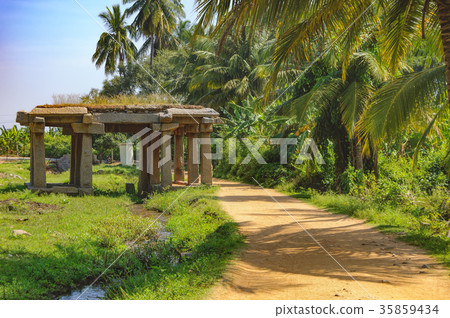 Sandy road and ancient ruins in Hampi, India 35859434