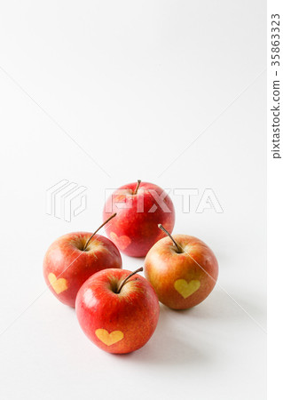 Red apples with a heart symbol 35863323