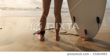woman surfer with white surfboard on the beach woman surfer with white surfboard on the beach 35864965
