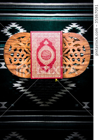 Koran - holy book of Muslims on the carpet Koran - holy book of Muslims on the carpet 35867091