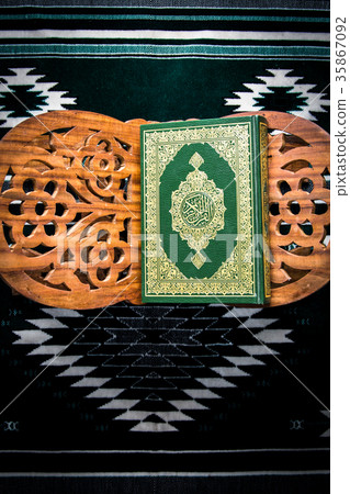 Koran - holy book of Muslims on the carpet 35867092
