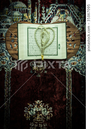 Koran - holy book of Muslims on the carpet Koran - holy book of Muslims on the carpet 35867095